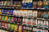 Shelves in a pet store filled with various brands and sizes of dog and cat food bags.