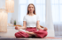 Woman sitting in a zen position after getting peptide treatment at AgeRejuvenation
