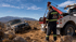 Towing Corona winch out and recovery service pulling a stranded SUV from rough off-road terrain.