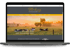 Laptop mit geöffneter Flechsig-Website, die Kühe auf einer Wiese im Sonnenuntergang zeigt.