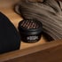 Close-up of the perforated lid of a cedar chip canister