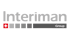 Interiman Group Logo: Grauer Schriftzug „Interiman Group“ mit einem roten Schweizer Kreuz.
