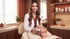 An esthetician in a white coat performs a facial treatment on a client using a handheld skin rejuvenation device.