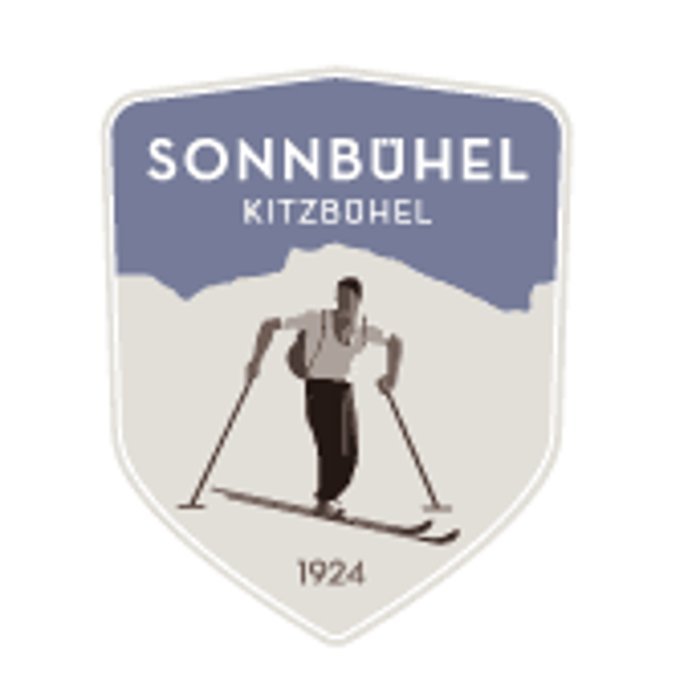 Wappen mit Skifahrer, Bergen und den Worten „SONNBÜHEL KITZBOHL 1924“.