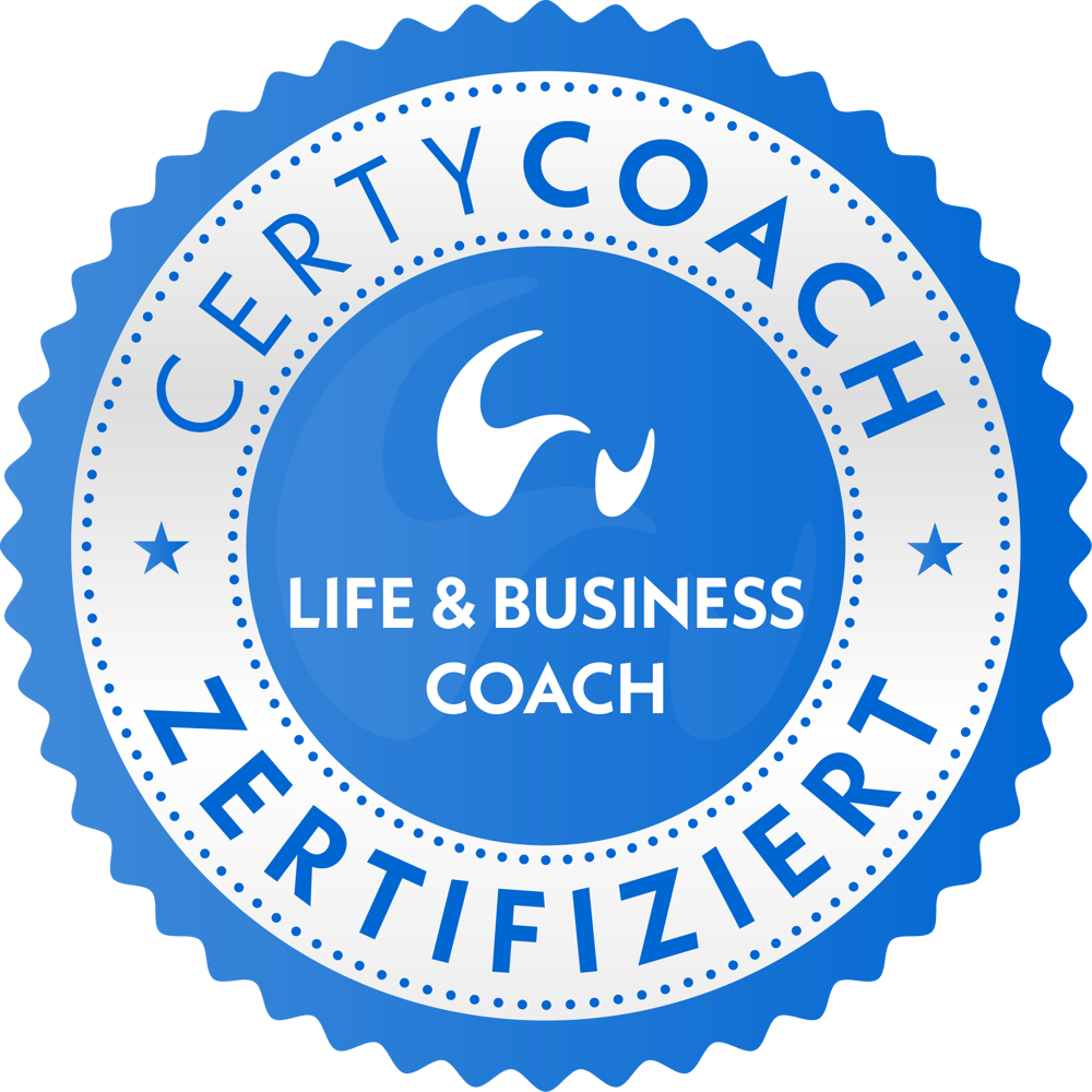 Blaues, gezacktes Abzeichen mit weißem Text "CERTYCOACH ZERTIFIZIERT" und "LIFE & BUSINESS COACH".