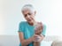 Senior woman experiencing nerve pain in wrist and hand discomfort