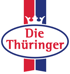 Logo der Marke Die Thüringer mit weißer Krone und rotem Schriftzug in einem ovalen Rahmen vor rot-blauem Hintergrund.