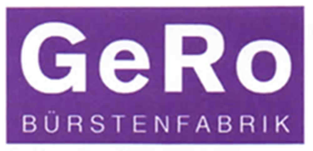 Lila Logo der GeRo Bürstenfabrik mit weißem Schriftzug auf violettem Hintergrund.