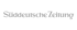 Das Logo der Süddeutschen Zeitung in grauer Schrift auf dunklem Hintergrund.