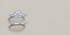 Ein Verlobungsring mit großem Diamanten im Halo-Schliff und ein passender Vorsteckring mit Diamantbesatz auf grauem Grund.
