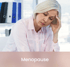Mature woman experiencing fatigue and discomfort during menopause, treated with functional medicine support.