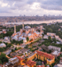 Aerial view of Hagia Sophia mosque and minarets in Istanbul, Turkey, with the city skyline and water in the background.