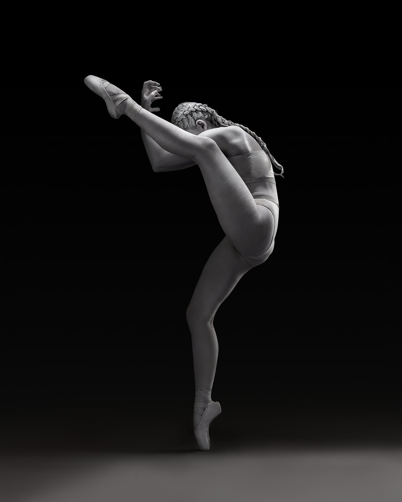 A black-and-white ballet portrait explores the shape of the dancer and tutu.