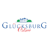 Glücksburg Ostsee Logo mit blauem Schloss und grünen Bäumen.