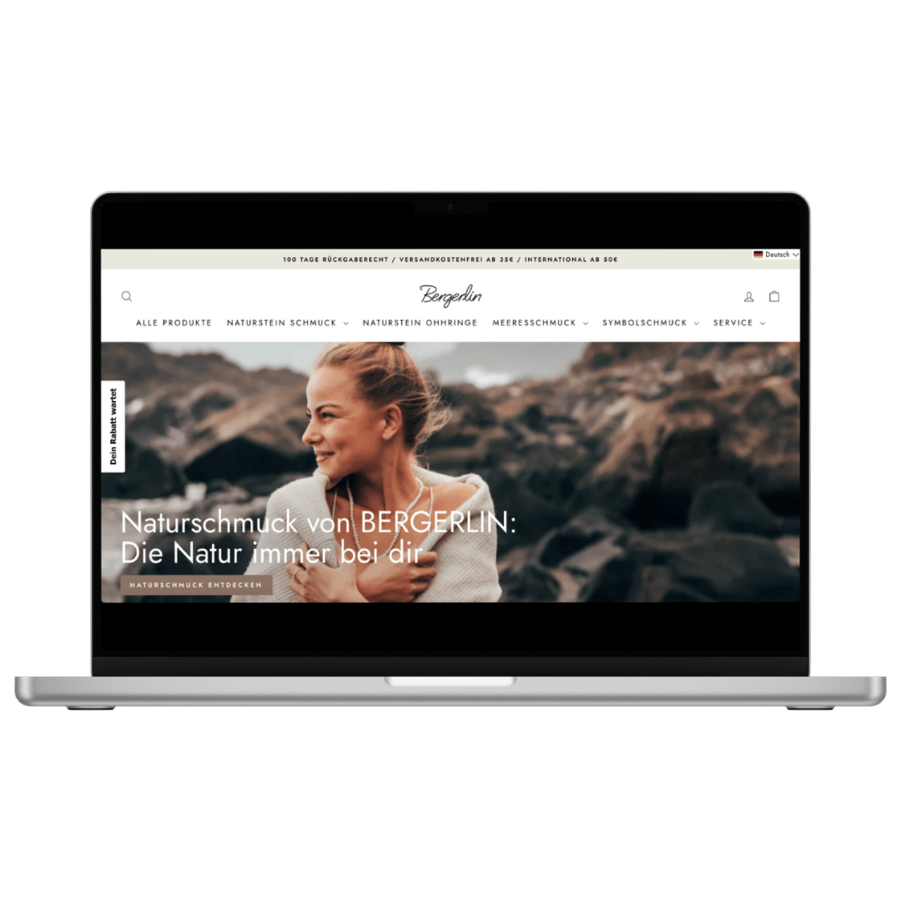 Laptop zeigt die Bergerlin-Website mit einer Frau vor einem Felsenstrand und dem Text Naturschmuck von BERGERLIN.