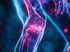 An artistic rendering of a human knee and leg with a glowing joint.
