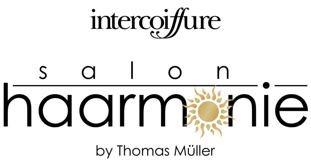 Goldenes Sonnensymbol mit geschwungenen Strahlen auf schwarzem Hintergrund.