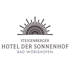 Logo des Steigenberger Hotel Der Sonnenhof Bad Wörishofen mit stilisiertem Sonnenmotiv.
