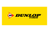 Dunlop Tires Logo auf gelbem Hintergrund mit einem schwarzen „D“ in einem roten Reifenprofil-Symbol.