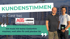 Zwei Männer lächeln vor einer Baustelle, mit dem Text "KUNDENSTIMMEN zu Gast bei ASS-LIEBENAU"