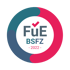 Runder Kreis mit den Farben Petrol, Grau, Pink und der Schrift „FüE BSFZ – 2022“, darüber ein roter Haken.
