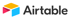 Airtable-Logo mit buntem, abstraktem Würfel-Symbol und schwarzem Schriftzug, moderne Cloud-Datenbank-Plattform.