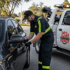 Towing Deltona car lockout service unlocking a vehicle door with professional roadside assistance tools