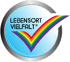 Blaues Logo "LEBENSORT VIELFALT" mit regenbogenfarbenem Häkchen in silbernem Kreis.