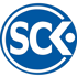 Blaues rundes Logo mit weißem Schriftzug "SCK" und einem Punkt.