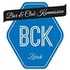 Blaues Sechseck-Logo mit "BCK" und "Zürich", schwarzes Band mit "Bar & Club Kommission" darüber.