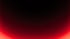 Dekoratives Bild mit einem weichen, kreisförmigen roten Lichtverlauf auf schwarzem Hintergrund.