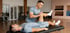 Physical therapist performing knee rehabilitation on a patient.