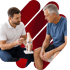 PT shows a knee model to a man in blue, explaining orthobiologics.