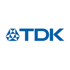 Blaues TDK-Logo mit geometrischem Sechseck-Symbol links und dem Schriftzug „TDK“ rechts.