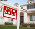 Red and white For Sale sign on a white post in front of a house, the point when a county time-of-sale well and septic evaluation applies