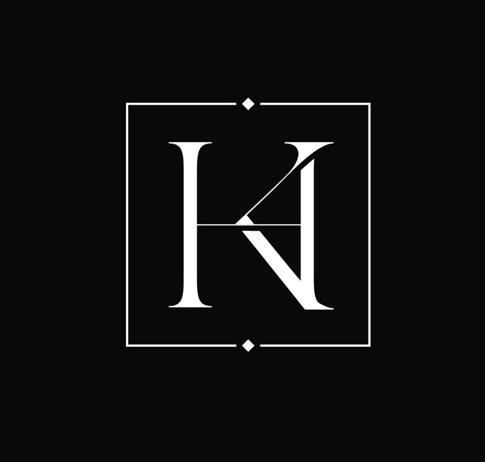 White serif monogram featuring the letters H and A interlaced inside a square frame on a black background.
