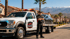 Towing Corona flatbed towing team with a tow truck and recovered SUV ready to provide reliable vehicle transport.