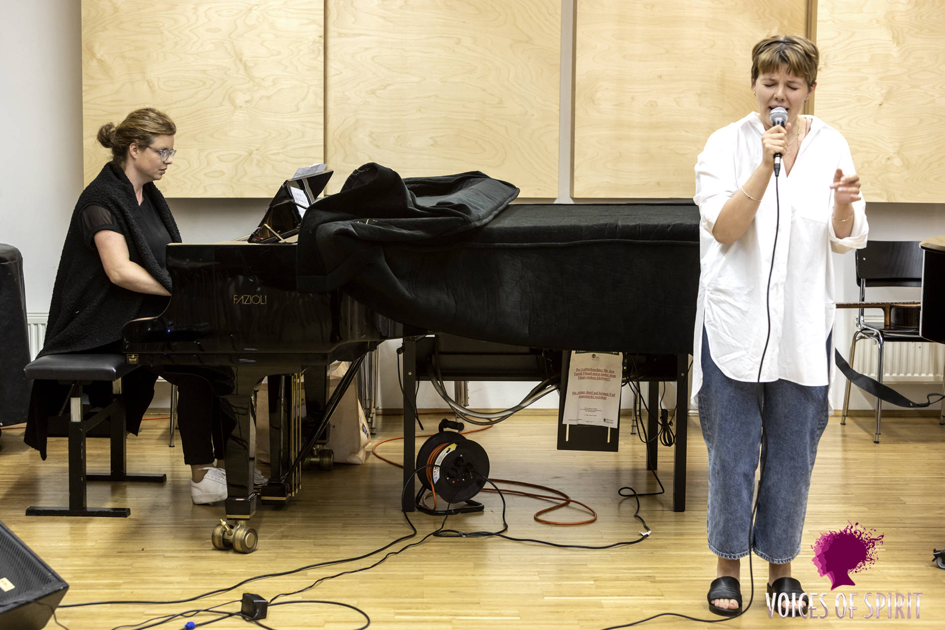 Workshop participants working with Simone Kopmajer at the Konservatorium, Voices of Spirit 2021, Graz