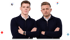 Zwei Männer in dunklen Pullovern stehen mit verschränkten Armen vor Logos von Figma, WordPress, Adobe und Ceros.