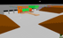 Bühnenmodell mit orangefarbenem Hintergrund, grüner Leinwand, Holzpodest und Tribünen in einer Arena.