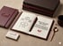 Open notebook with a Peter Sechehaye PR agency business card symbolizing your next career step