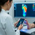 Doctor scanning a patient's foot to create custom orthotics. 