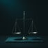 A level brass balance scale in low cyan light