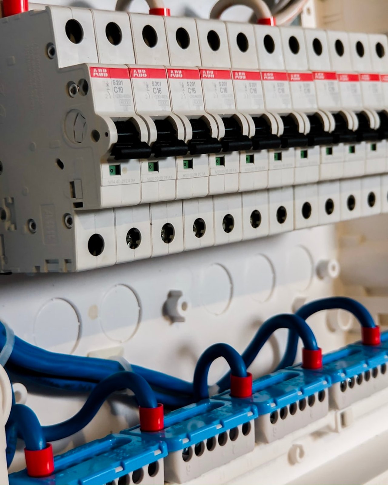 Circuit breakers in a residential electrical panel during an EV charger load calculation