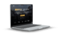 Laptop zeigt eine Immobilienmakler-Website mit dem Text "Ihr immobilienmakler - modern. zuverlässig. zielorientiert."