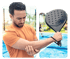Man clutching elbow on court, illustrating sports injury rehab