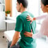 Therapist treating man for work-related back injury