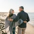 Senior couple enjoying beach, reflecting regenerative stem cell therapy benefits
