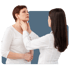 Female doctor palpating the neck of a female patient to check her thyroid.
