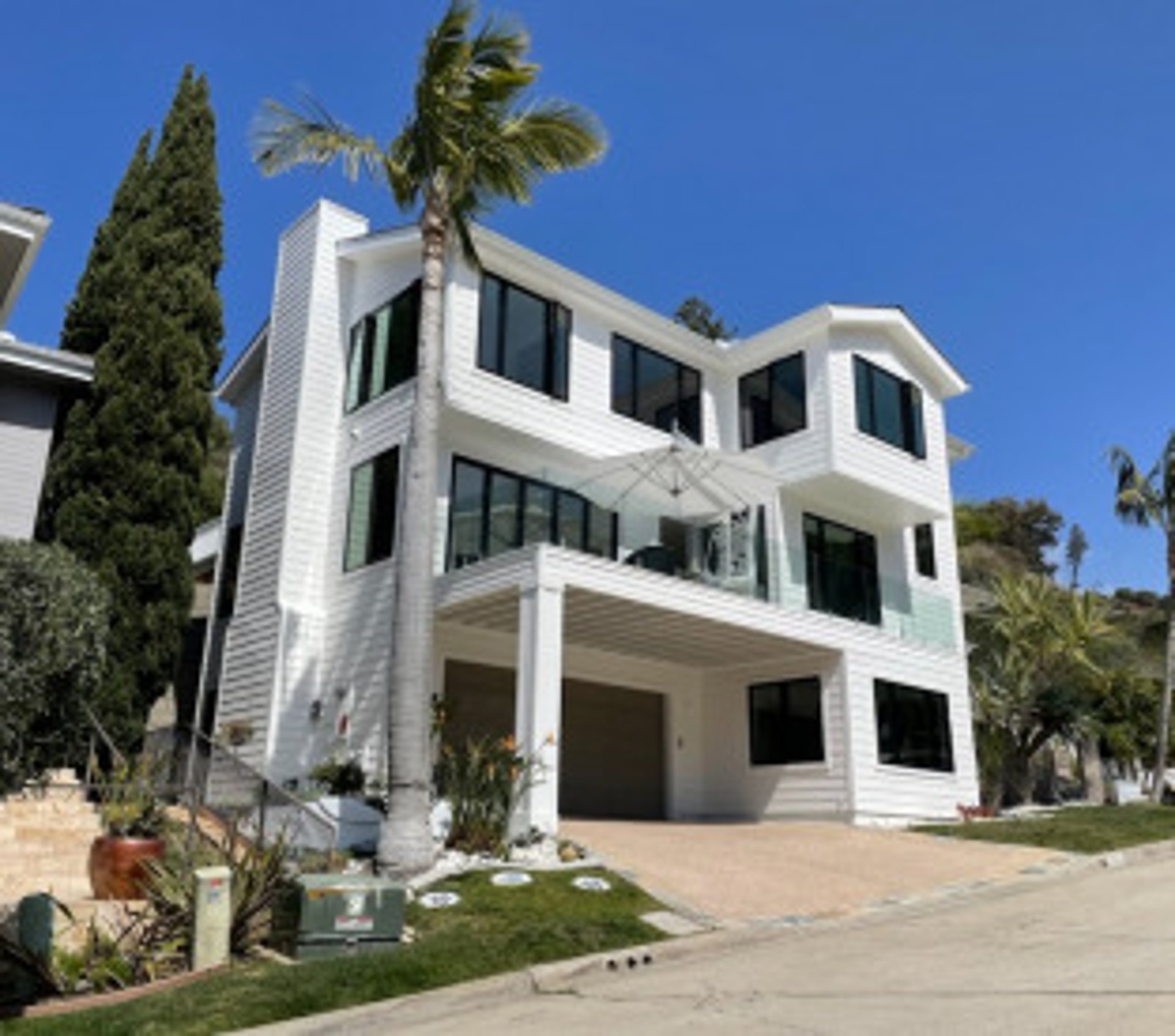 James Hardie Siding, Andersen Windows, and Texture Coating Installed on a La Jolla home by Approved Contractor, Inc.